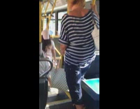 Woman carries white Louis Vuitton and Michael kors purse bag on the bus