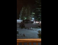 Two shirtless guys ride in on snowmobile asking for beer