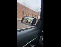 Spongebob plushy tied in front of truck