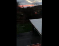 Sunset reflects red light over the clouds