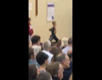 Little boy dancing to choir singing 