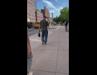 Man walk street pet bird on hand