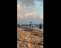 Guy hold girl upside down v split