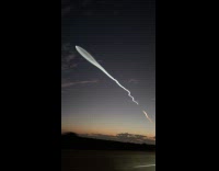 Space X rocket over Los Angeles skyline