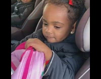 Baby girl waits for beat to drop