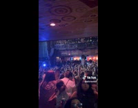 People in Nightclub Raises Hand in Sync 