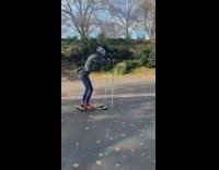 Guy uses roller skis on trail 