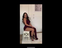 Girl wearing army uniform changes into dress 