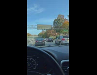 Woman drives and talks to someone on call 