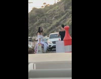 Guy narrate two girls take picture car