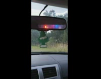 Guy gets pulled over by police for robbing a bank, sirens in rear view mirror