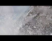 Guy got his camera wet by splashing waves