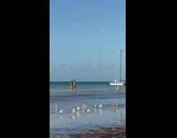 Woman black bikini dance video shoot beach seaside