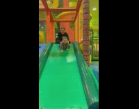 Baby boy crawling down slide does scorpion 