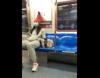 Two women sitting apart are matching