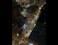 Collab WINY - Person on building film fireworks from street