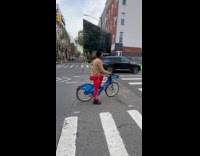 Man ride bike carry flat screen tv