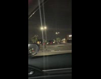 Night time parking lot flashing lights rave music 