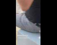 Man striped shorts has toilet paper hanging from pants 