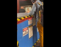 Man eats food on hazardous waste storage