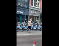 Man with headphones sings loud at street