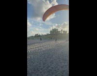 Man tries to parasail while another man films him