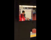 Man read jacket play with slinky subway