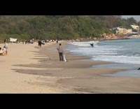 Man wave white and green towel beach