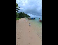 Woman drone video beach run but tripped
