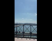 Man changes pants in the bridge while two women reacts