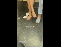 Woman with blue nail polish barefoot inside the train