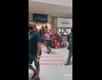 Men buy flowers for valentines day 