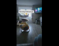 Kid Spins on her Seat as Music Plays