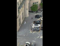 Woman white dress hat pose outside hotel