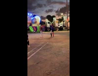 boy kicking leg up carnival fair