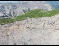 Drone shot around flat top mountain alps