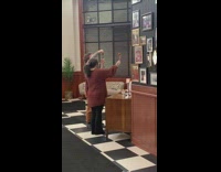 Woman hold meatball spaghetti beside old photo