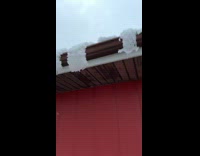 Curved and split ice formed on roof