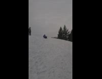 Guy in blue jacket shirt goes down snow hill falls backwards and folds scorpion