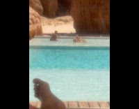 Woman on sunbed poses while man pictures Part 1