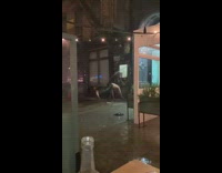 Guy does handstand in the pouring rain 