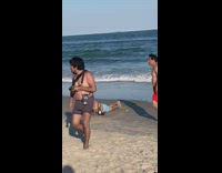 Man lie down with wine and glass at the beach