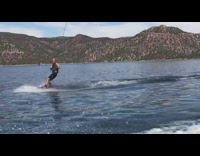 Man ride wakeboard behind boat, tries to do superman pose and crashes into water