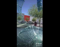 guy runs breaks car front view window