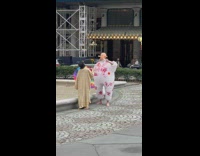 Guy in blow up inflatable suit and creepy baby mask