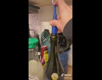 Blue tampon put into the top of wine bottle to cork it