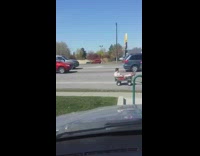 Woman on electric wheelchair pull cart passenger