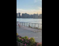 Woman pulling a bunch of cinderblocks by rope to workout
