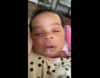 Baby sleeping milk in mouth