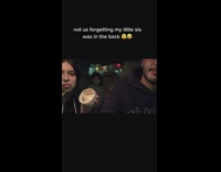 Couple Kiss as Kid Watches from Backseat